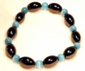 Magnetic Bracelet Blue Cats eye and Olive beads repeated.